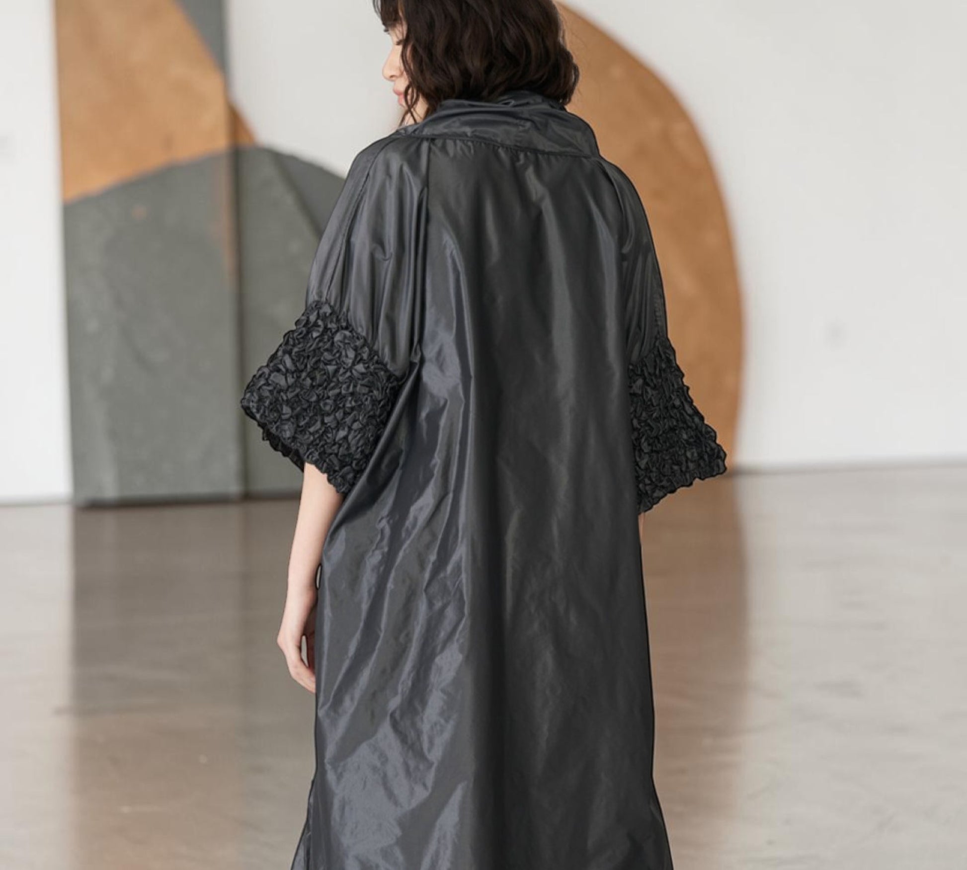 Black Avant-Garde Sculptural Cape with Textured Sleeves & Statement Rosette - Above the Crowd Boutique