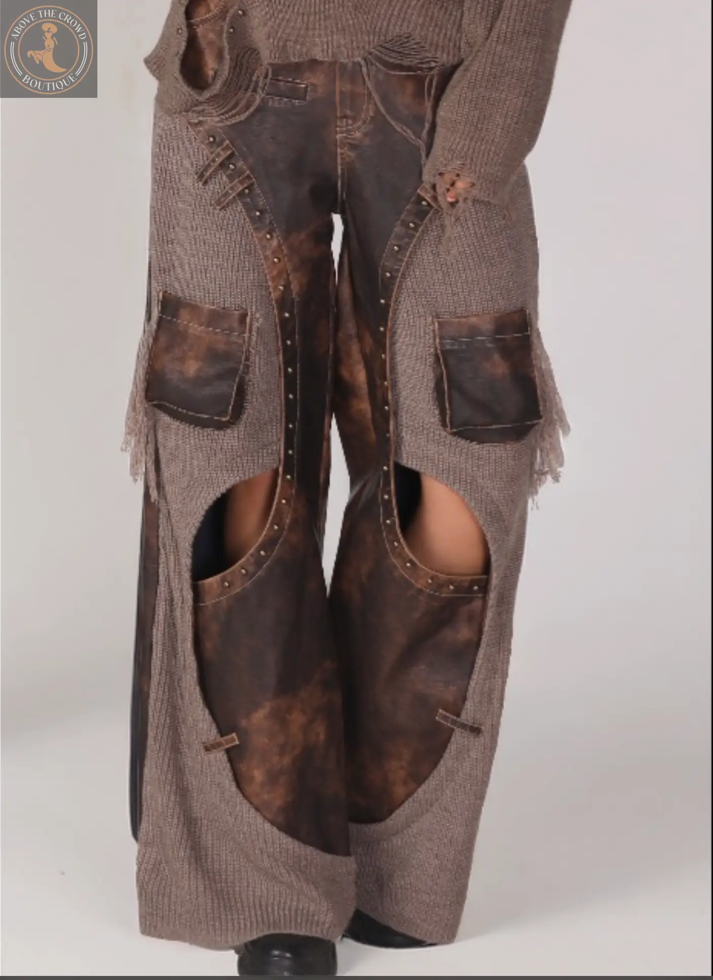 Brown textured cardigan with leather patch details on a white background