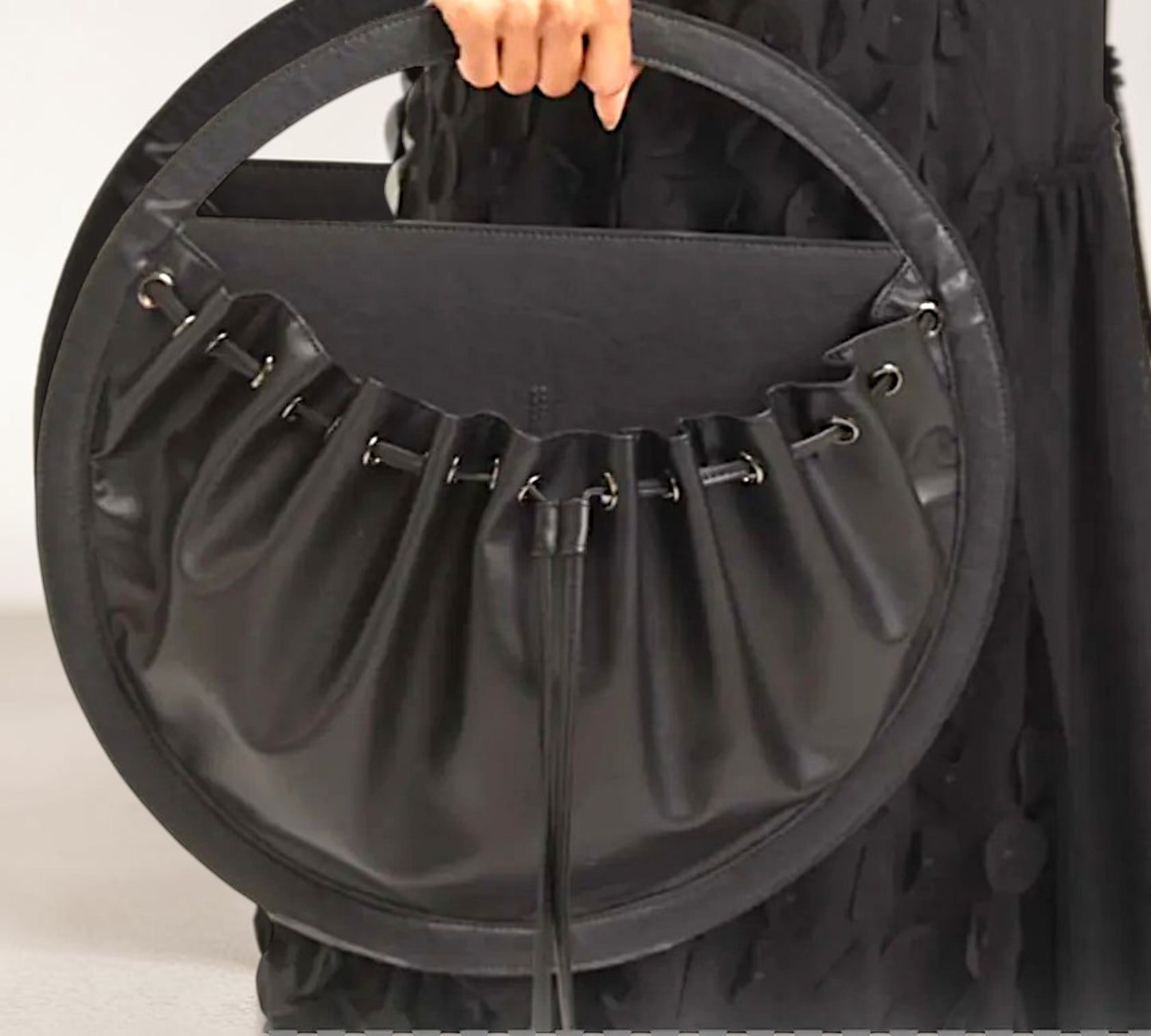 Black Sculptural Circular Drawstring Handbag