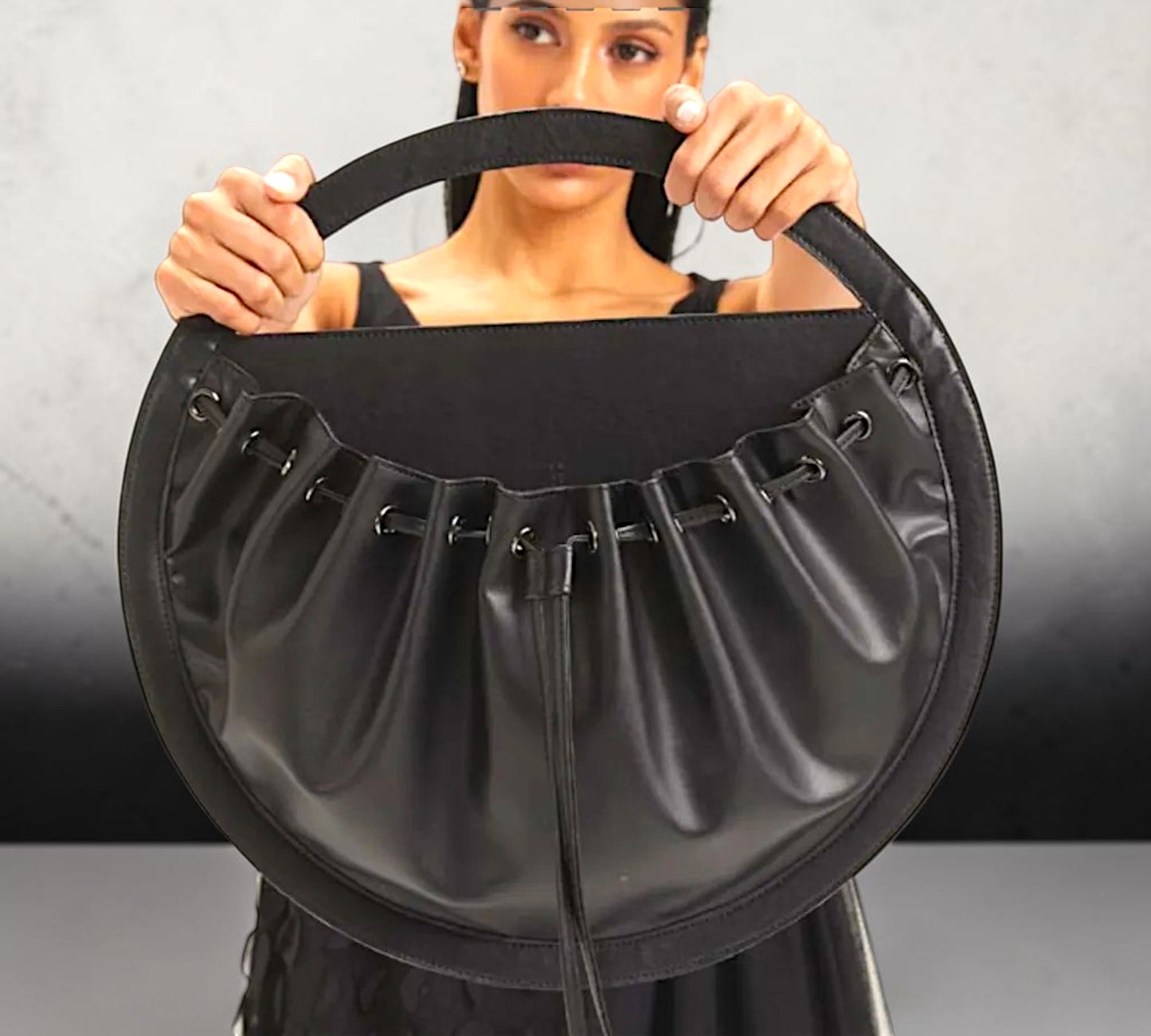 Black Sculptural Circular Drawstring Handbag